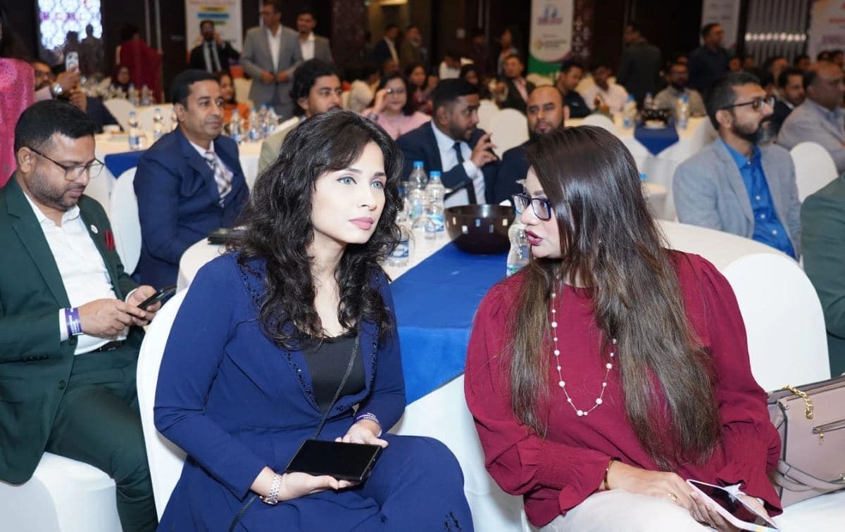 Two delegates deep in conversation at the Annual HR Conference 2025