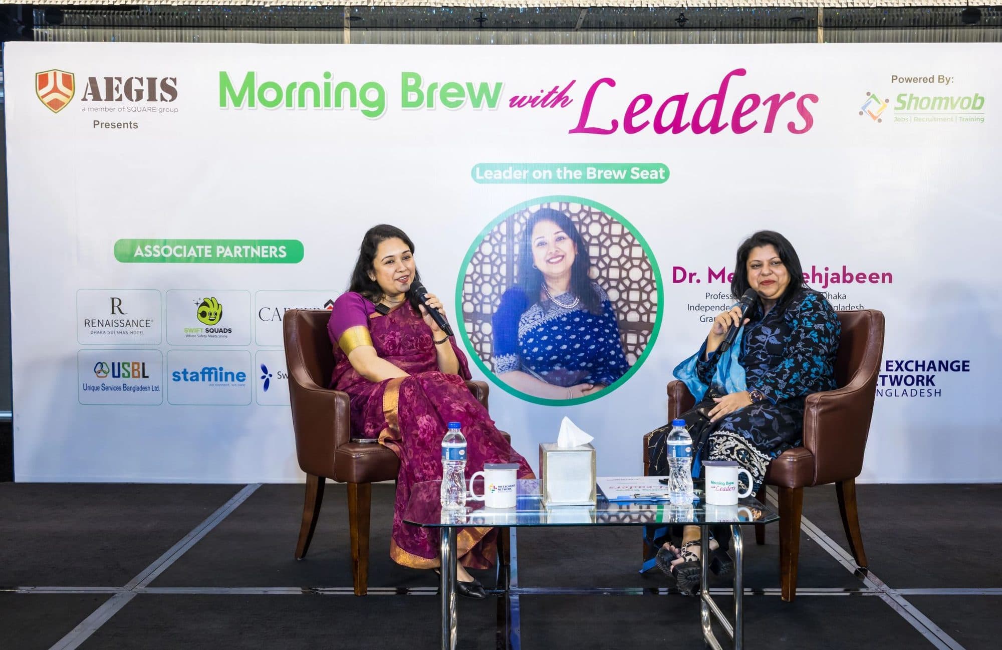 Guest and moderator seated on the Morning Brew with Leaders stage