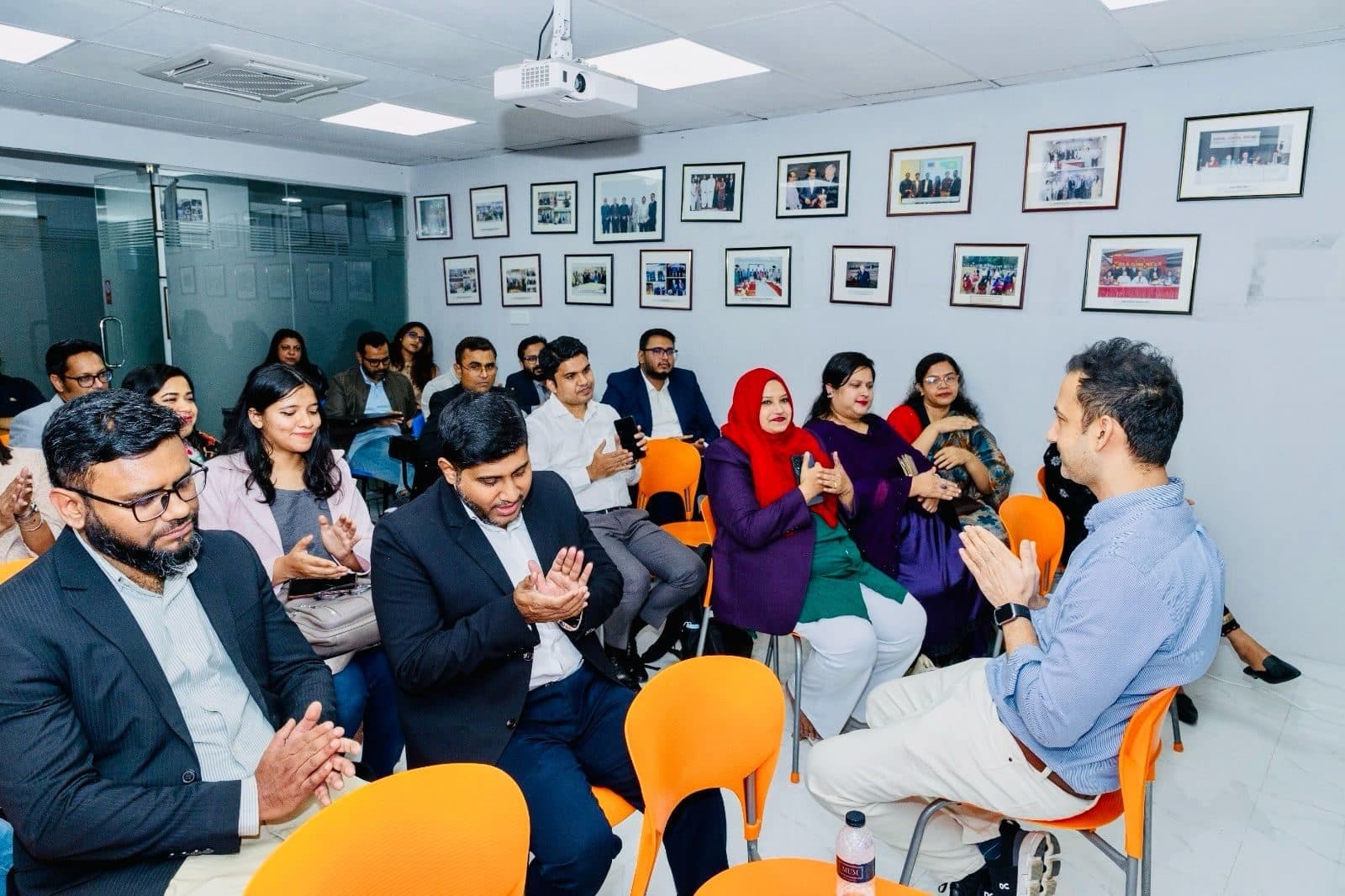 Participants seated in a circle, laughing during the Velocity session